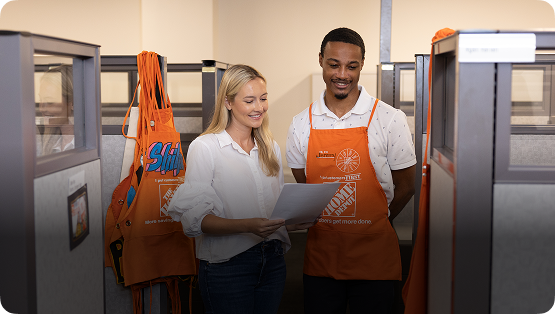 Two associates having a discussion in an office setting